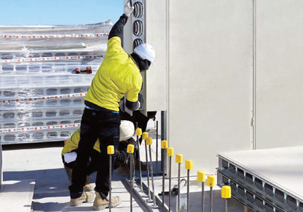 A team of three men installing AFS Logicwall for Intertenancy Walls