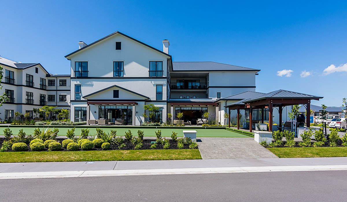 Summerset Retirement Village - AFS Logicwall Intertenancy Walls Three storey Summerset retirement village with bowling greens in front of it.