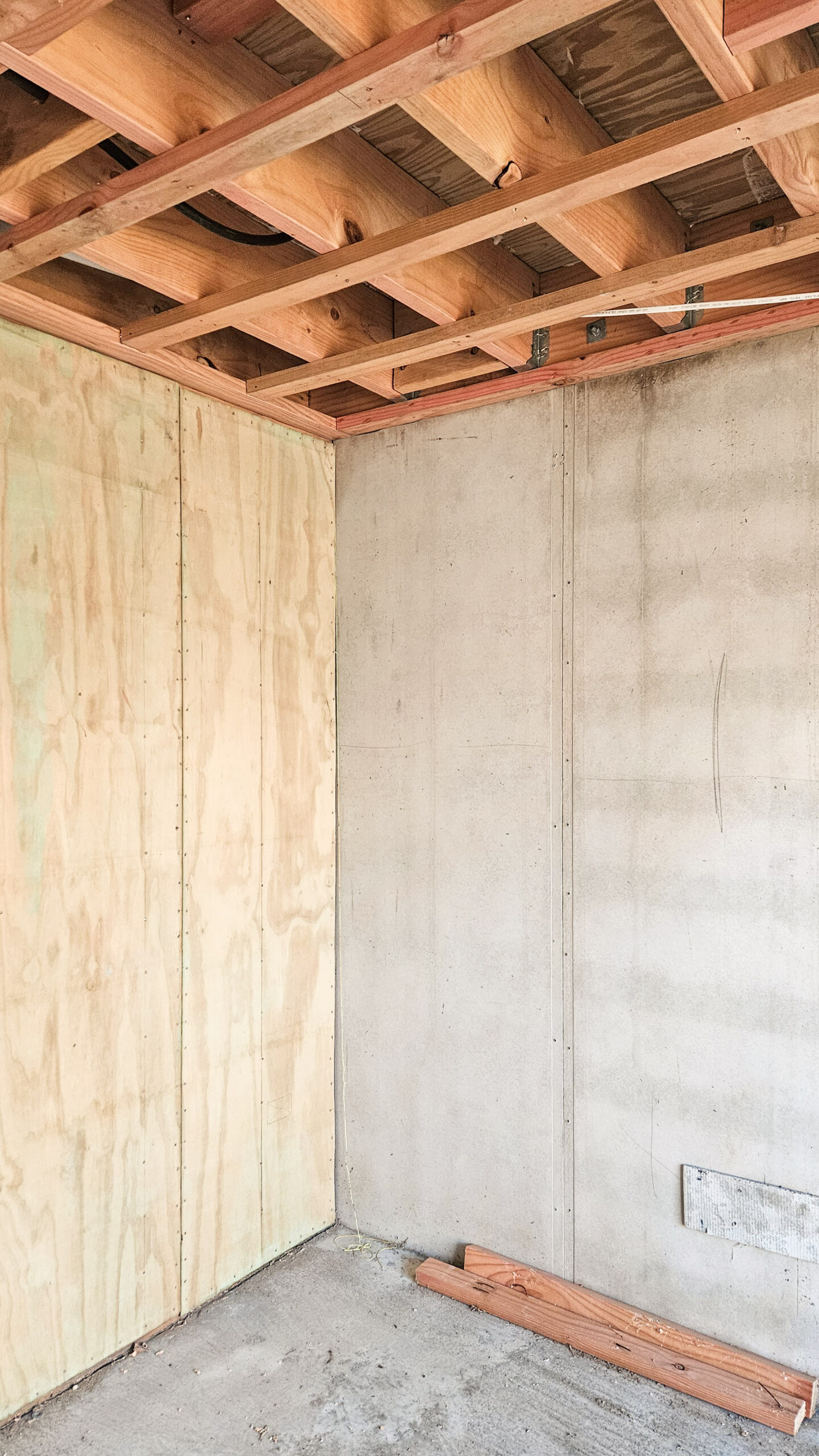 During construction on a house build located on a steep site with builders installing Rediwall for the retaining walls. 
